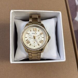 Gold Fossil watch, just needs a new battery.